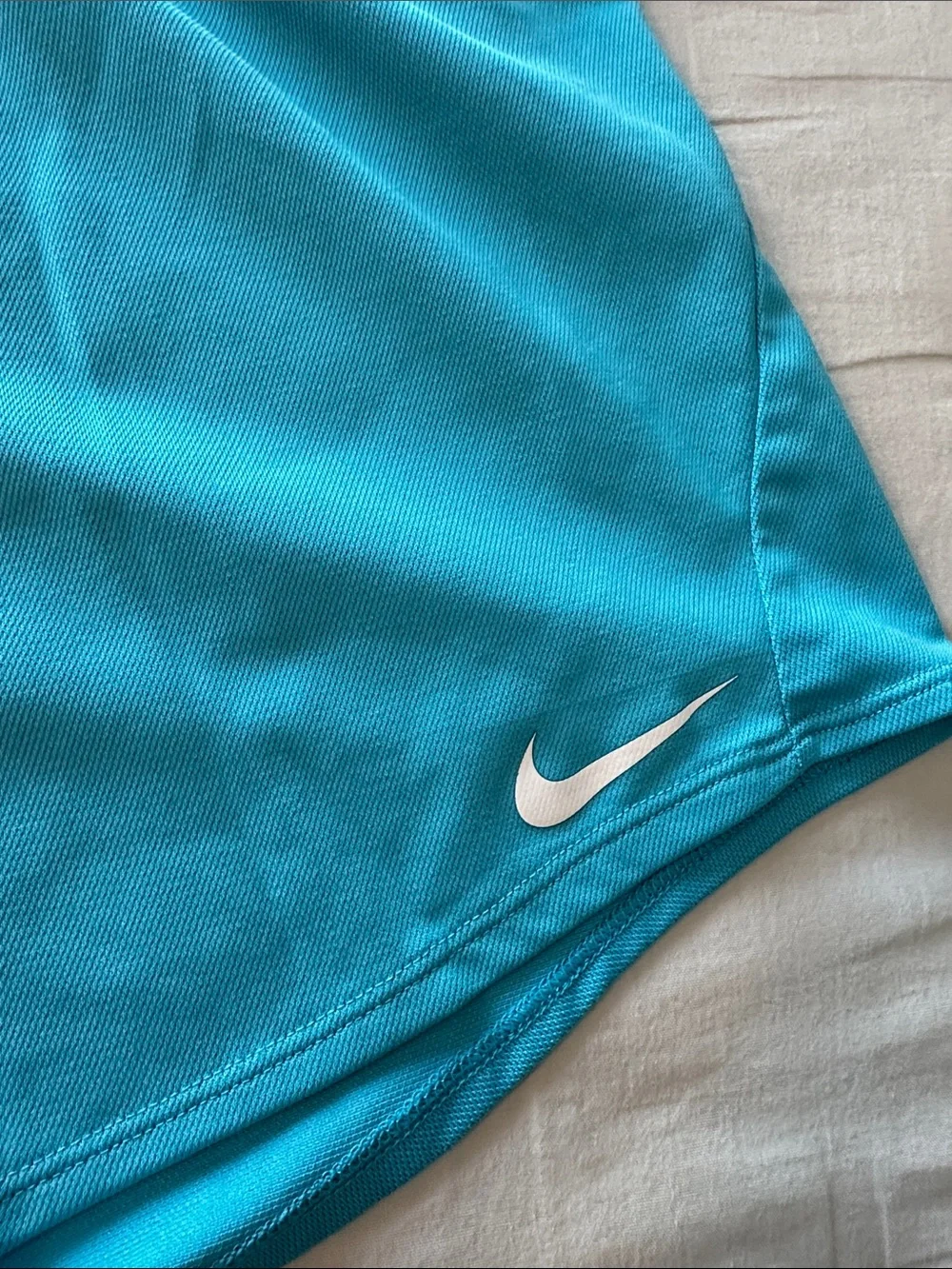 Nike Turquoise Performance Shorts with White Swoosh